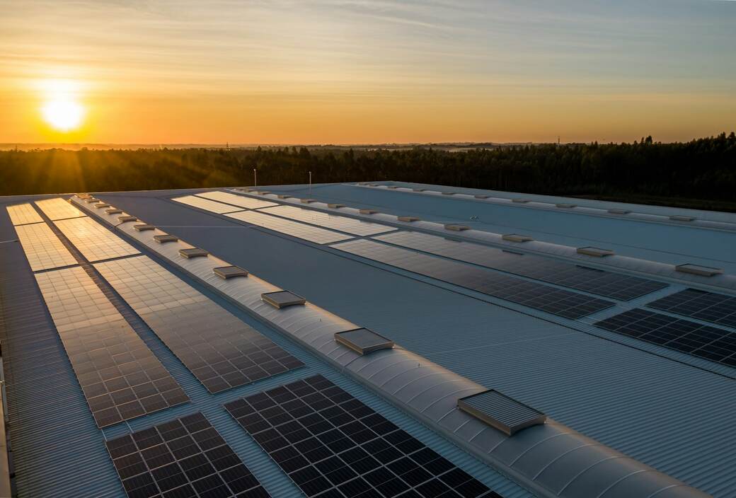 Rooftop solar panels at sunset