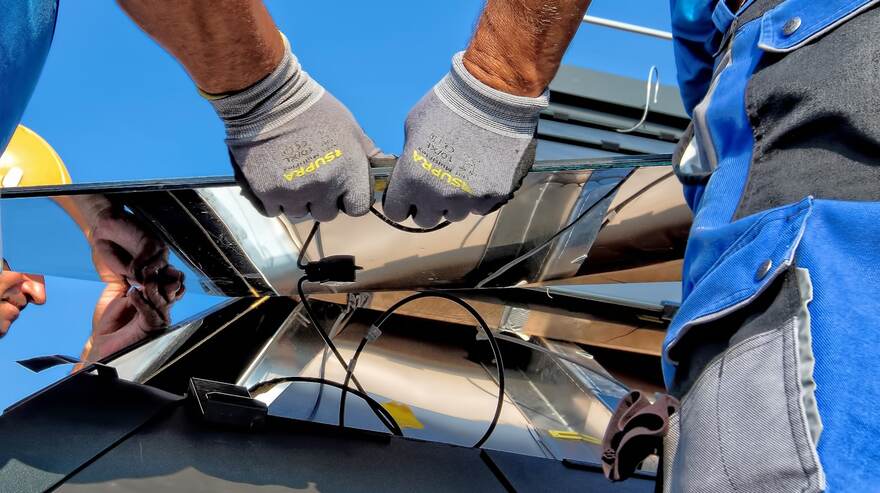 Arish Solar technicians installing a panel